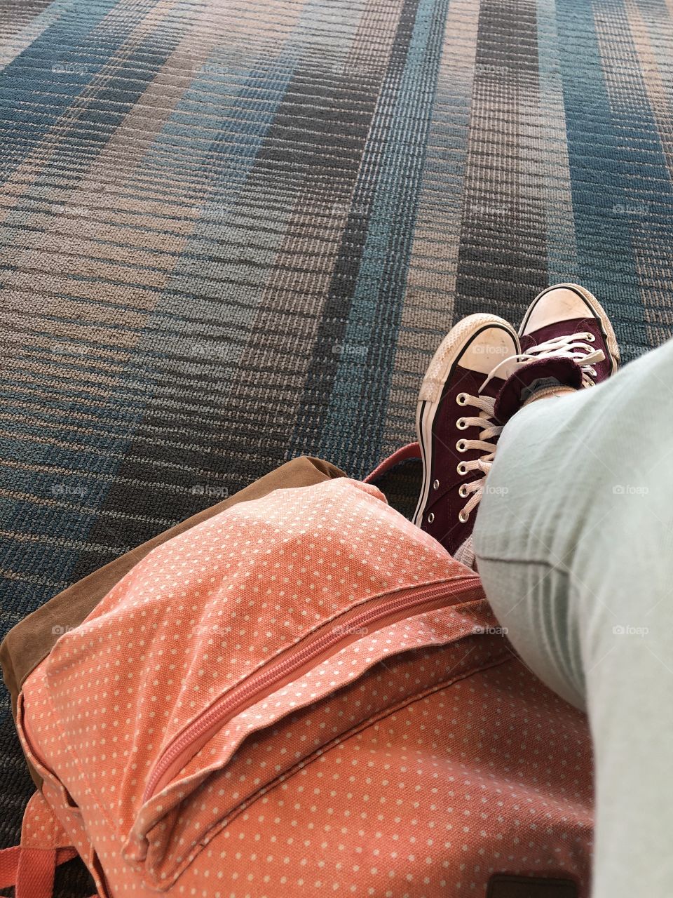 Sitting around, waiting on an airplane.