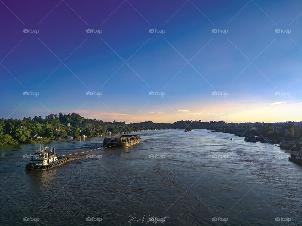 View on Borneo river, a coal ship.