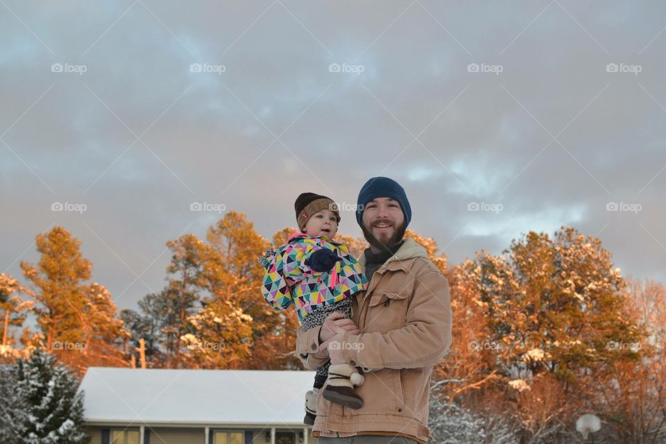 Portrait of a happy man with her baby girl