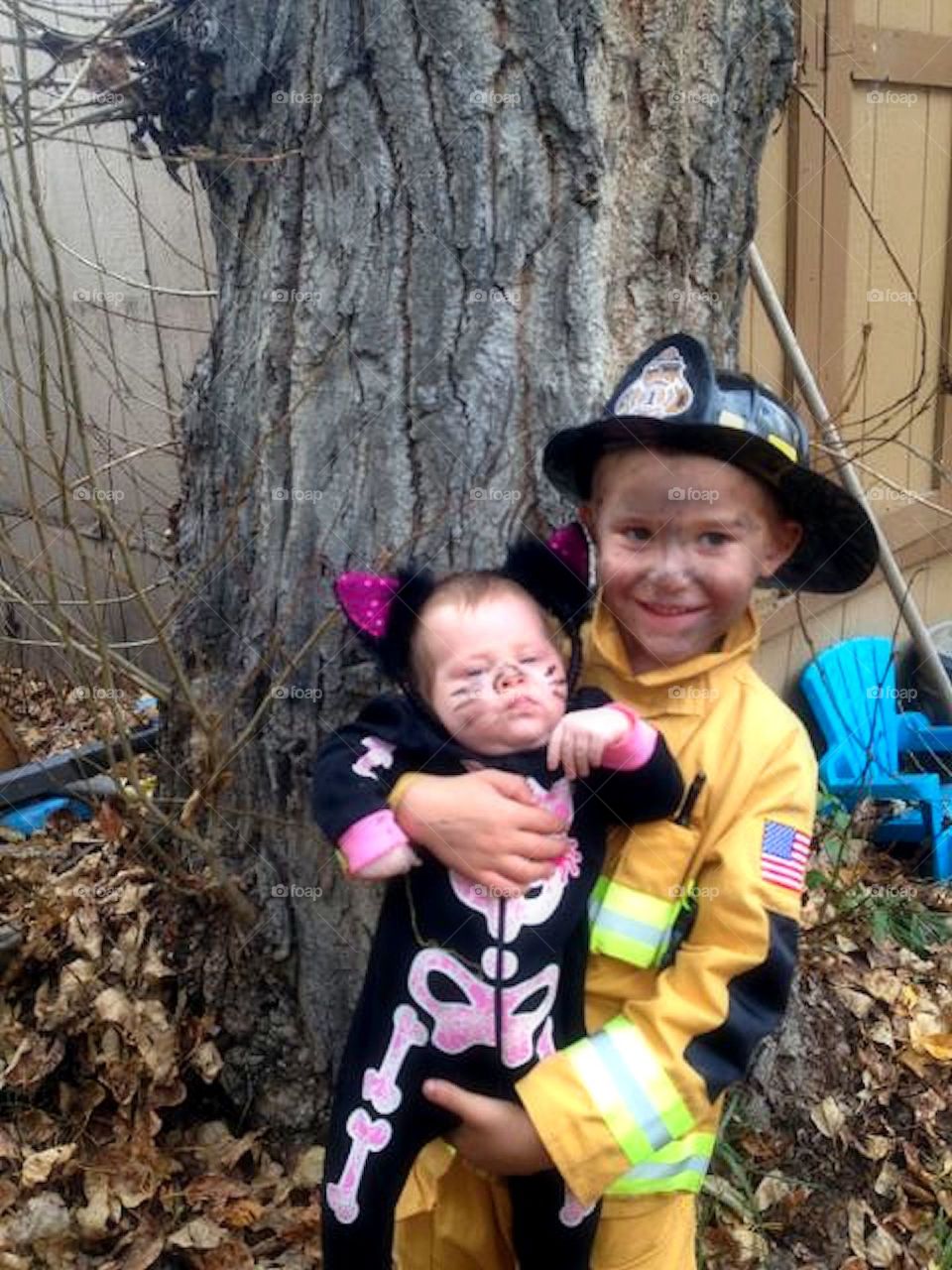 Halloween Rescue. What a pair for Halloween !!! A fireman that just rescued a skeleton kitten out of a tree.