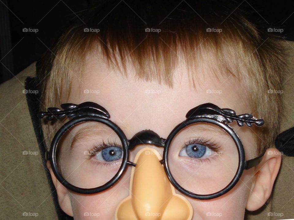 Ellipses and Shapes, Toy eye glasses on a little boy