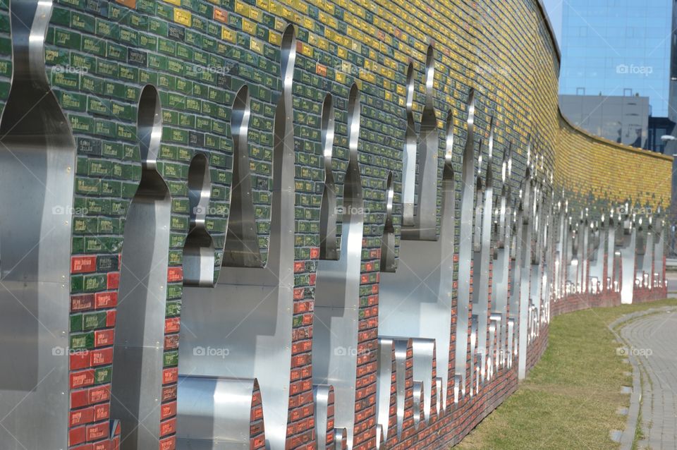 Colorful monument with people solute holes. Vilnius