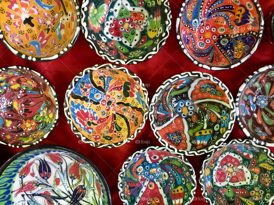 Old souk in Dubai selling colourful small bowls 