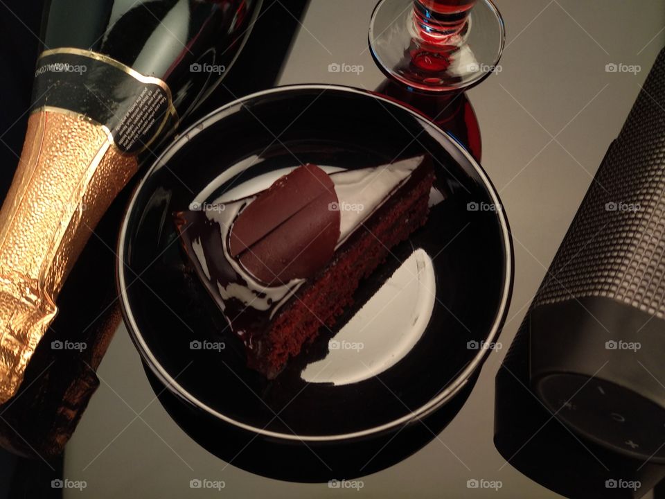 Chocolate cake / pastry with champagne bottle
