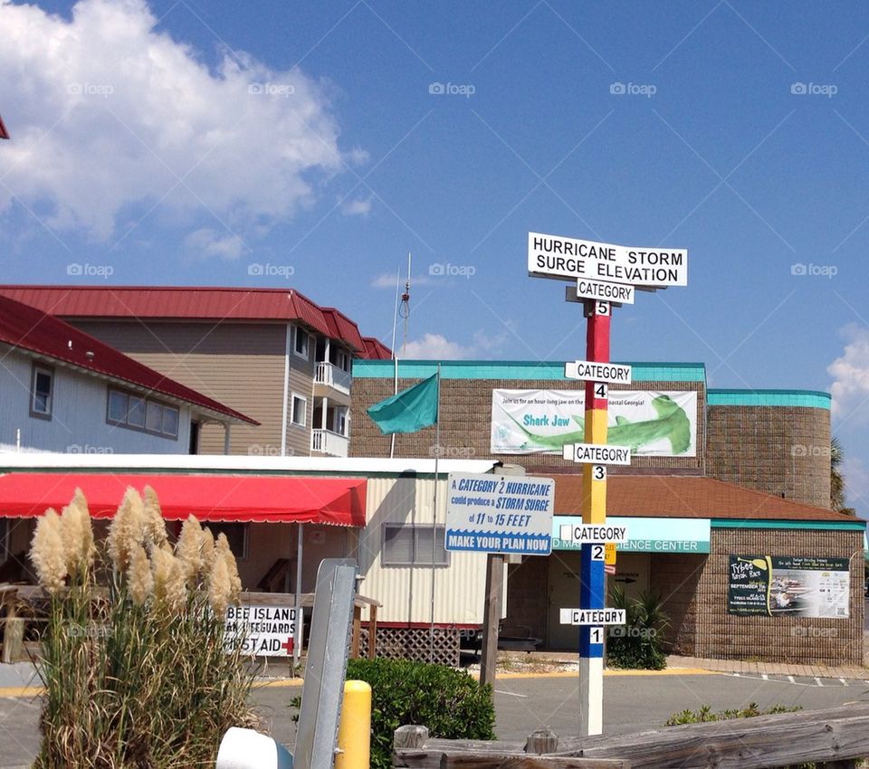 beach sign warning pier by cable