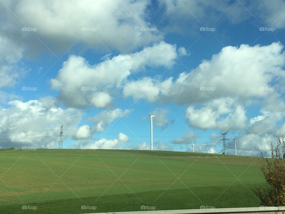 Windmills electric on sunny day