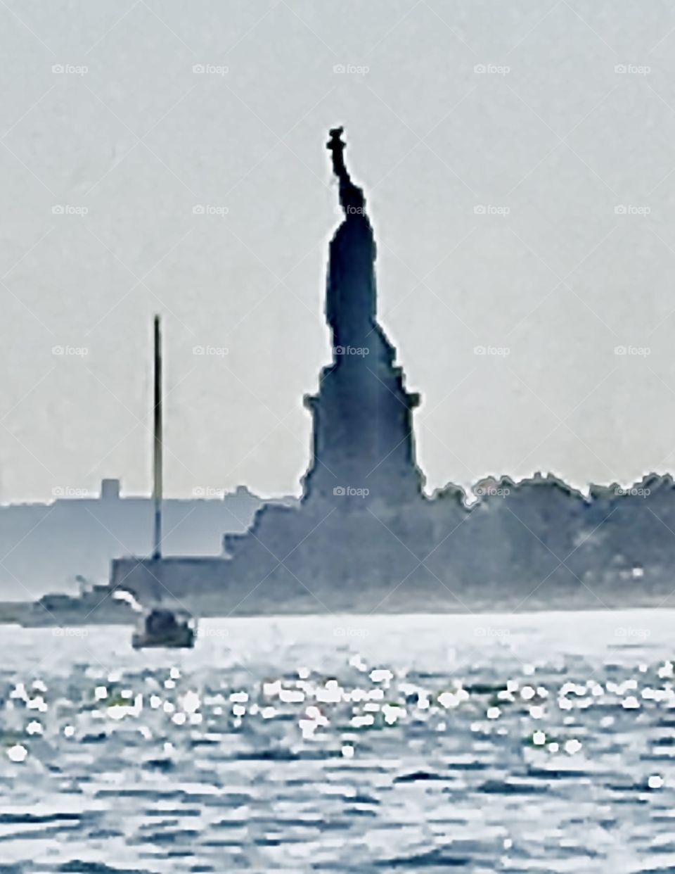 The „Statue of Liberty“ was seen on the way to „Liberty Landing“ in New Jersey traveling by the waterways on our sailboat, the „Salvation“. The statue cannot be approached quite this close so we used a zoom. 2018. Hypnotic Productions