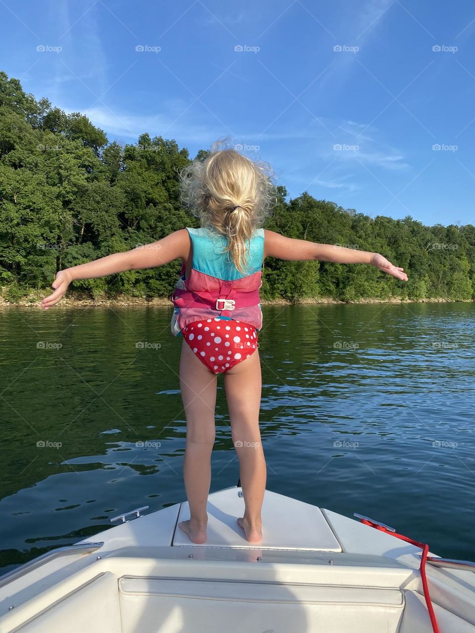 Little girl enjoying her best life on summer vacation on Lake Cumberland in southern Kentucky 