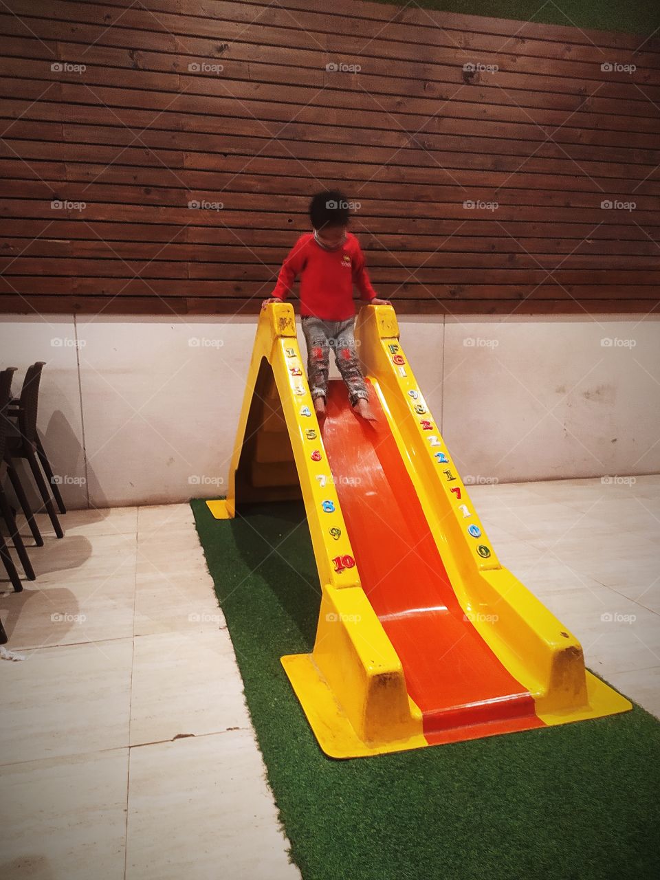 Baby Enjoying sliding in holiday time masti time