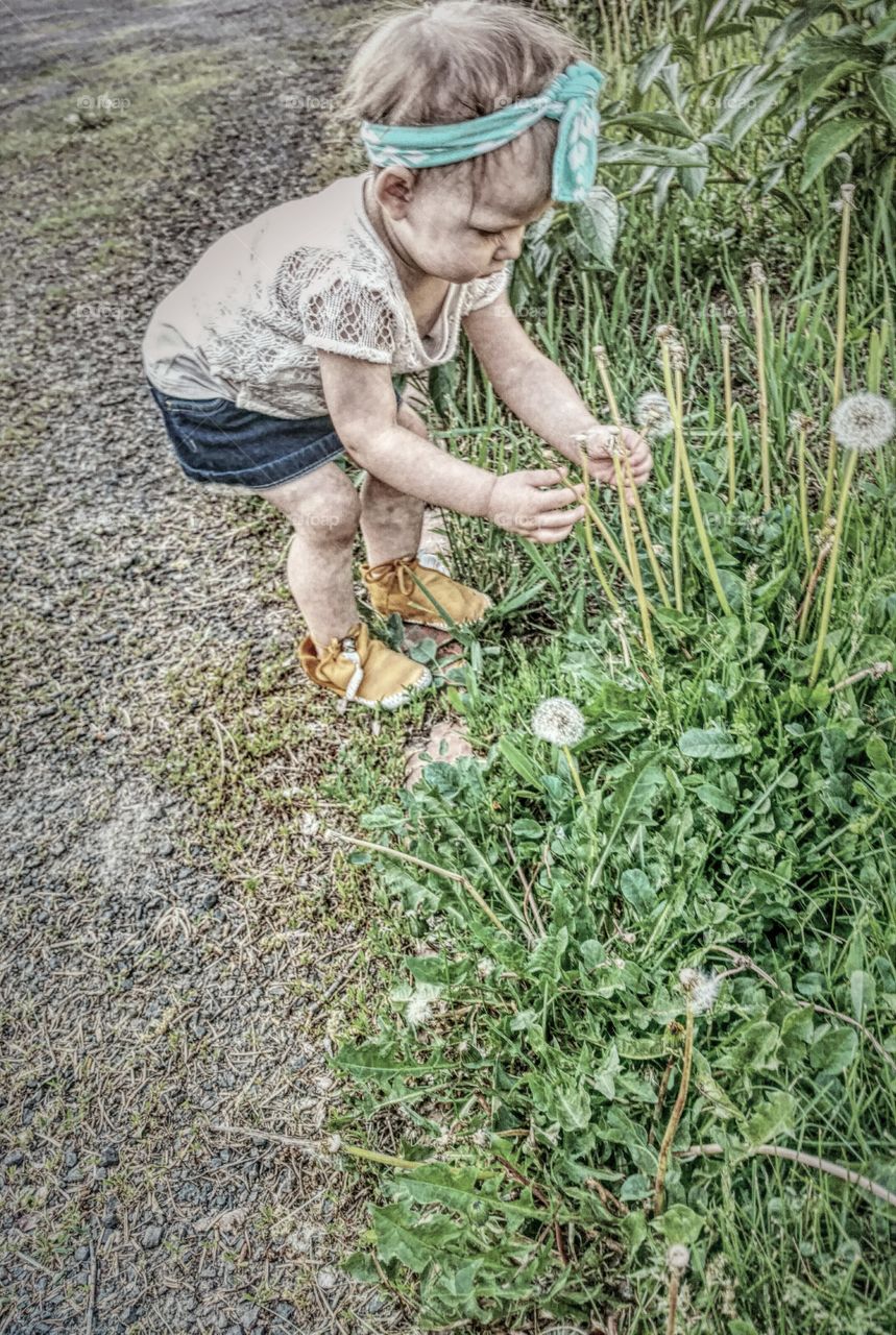 Messy girl picking flower