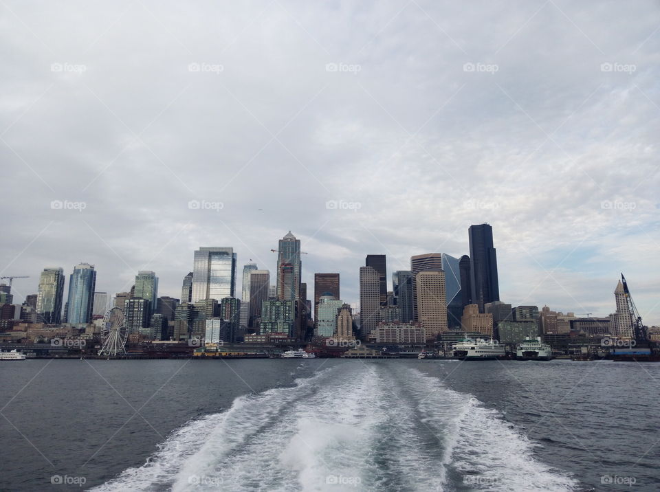 picturesque view from water on Seattle skyscrapers on a cloudy day