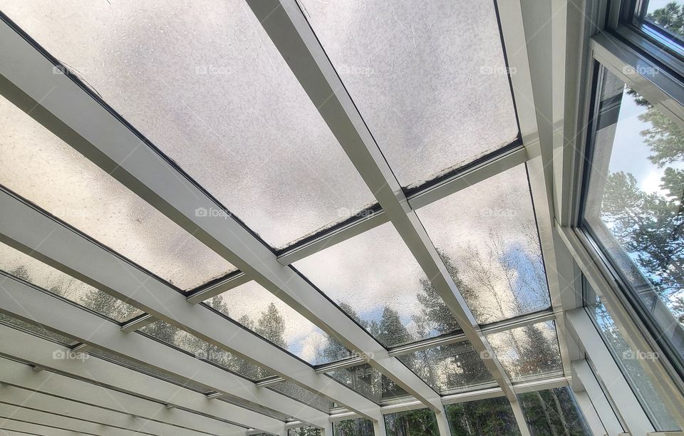 Storm clouds rolling in over the greenhouse