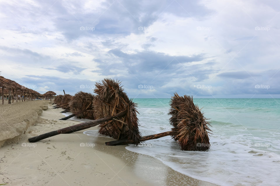 Fallen sunshades on the beach, Cuba, Varadero