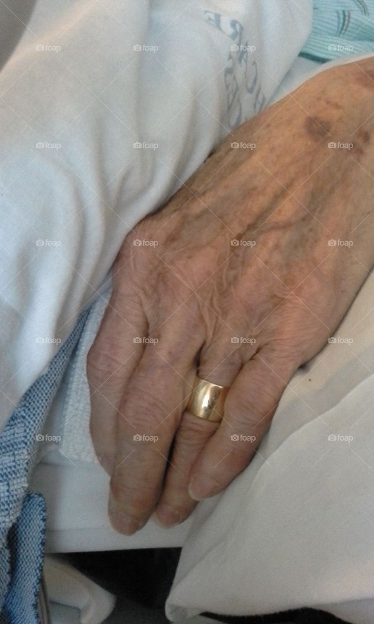 This photo was taken the day before my gramma passed away at the age of 91. She worked all her life, including taking care of my Grampa for 11 years after his stroke, until he passed away. Her wedding band is a symbol of their 64 years together.