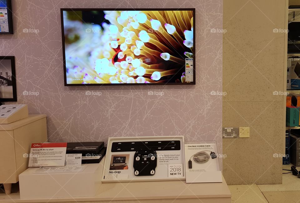 The Frame TV 43" installation featuring no gap wall mount and one near invisible cable at Peter Jones Sloane square Chelsea King's road London