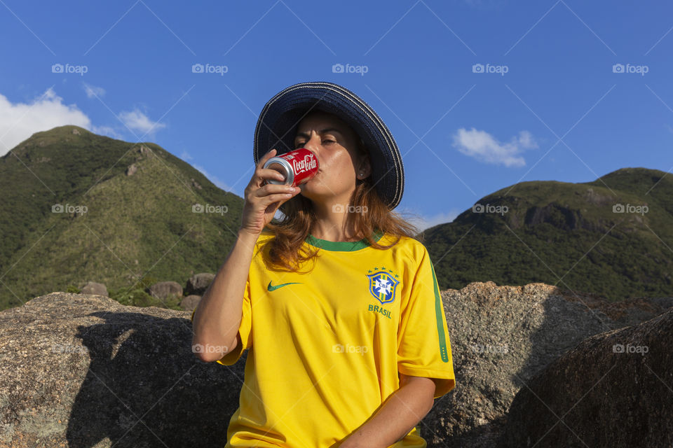 Drinking Coca Cola on the mountain.