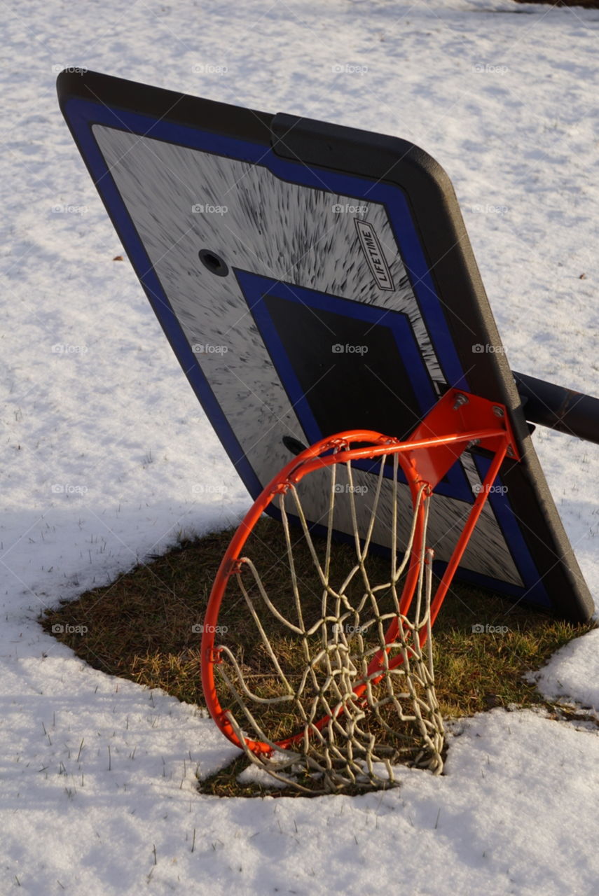Basketball hoop, lying on its side. 