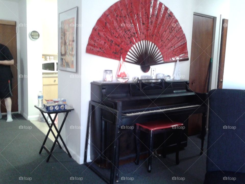 piano & fan. this id my piano and s red fan