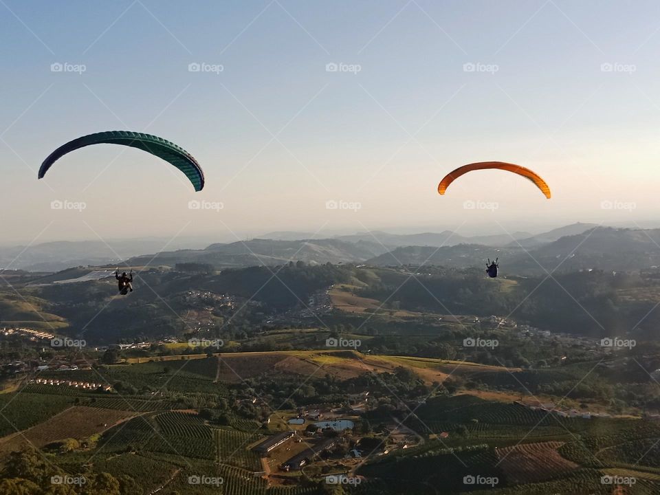 Two paragliders ovet a valley