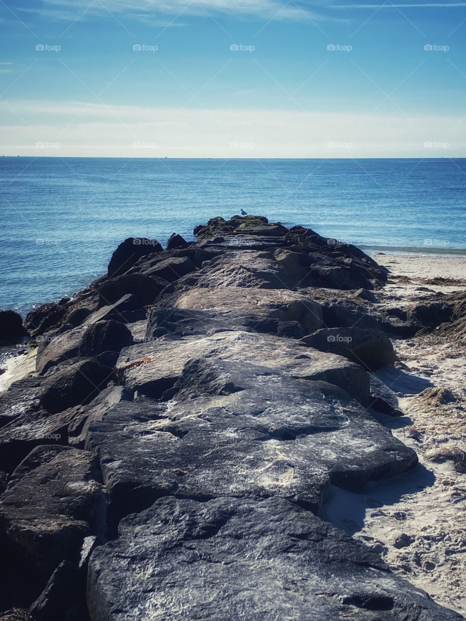 Morning walk along the beach, stopped by a rock jetty to take a photo 