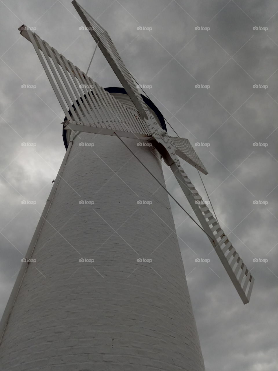 Looking on a windmill with grey clouds