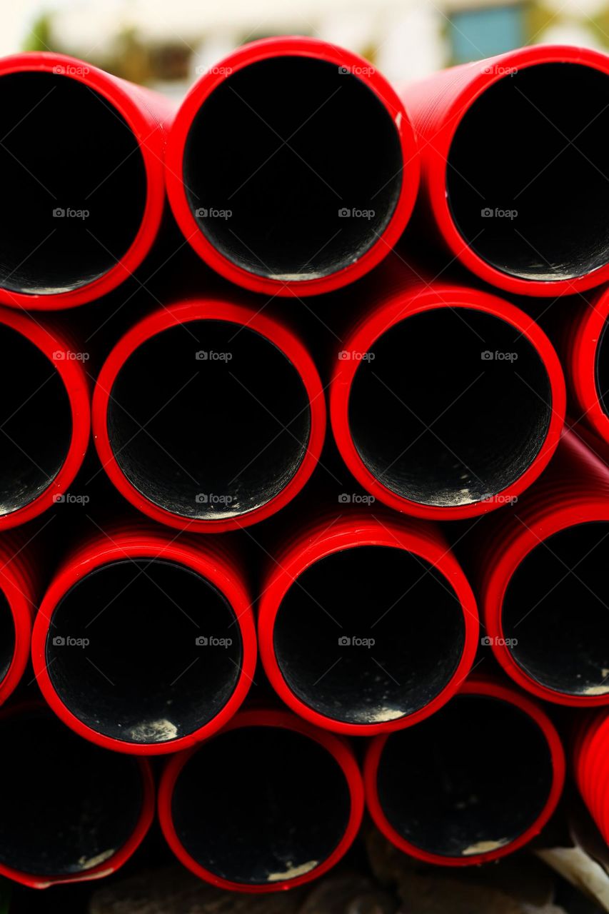 red-black plastic pipes of a round shape, geometry, building, circle