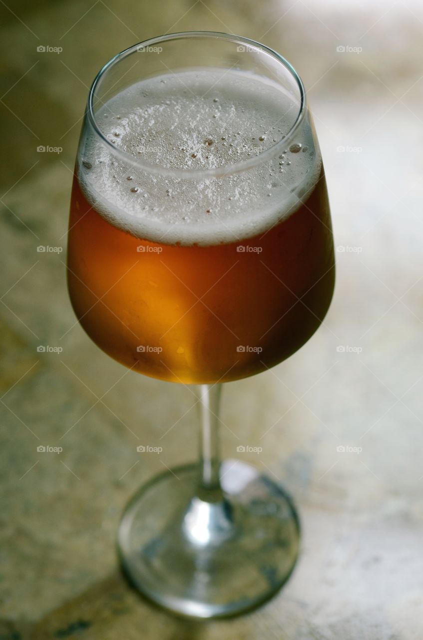 A closeup of a cold glass of beer.