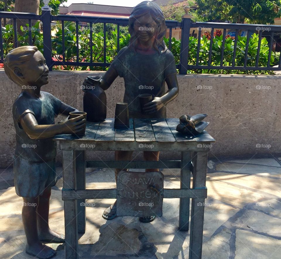 Lemonade stand sculpture.