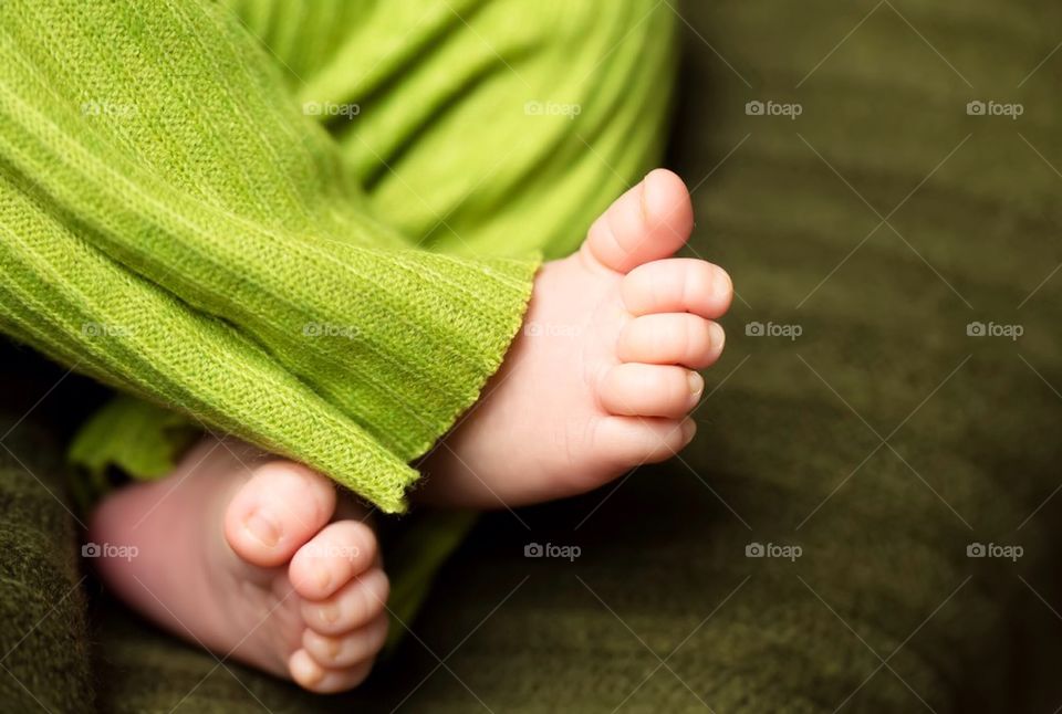 High angle view of baby feet