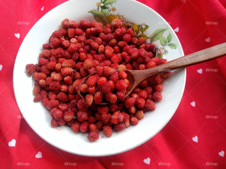 ripe red wild strawberries tasty healthy food on a plate top view