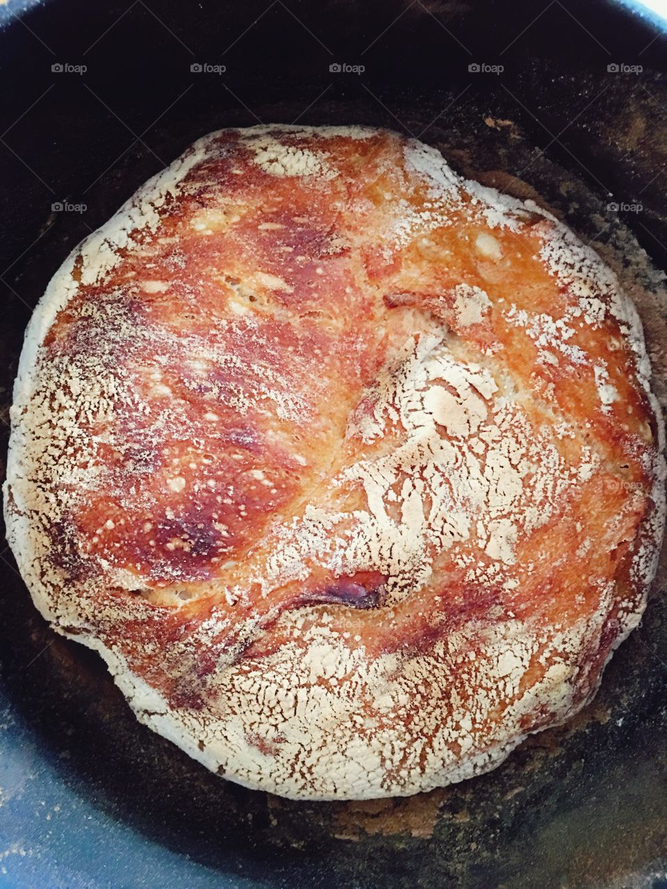 Homemade Dutch oven bread in cast iron pot