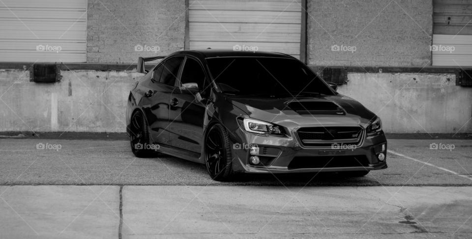 Dark grey Subaru STi spotted at an abandoned loading dock