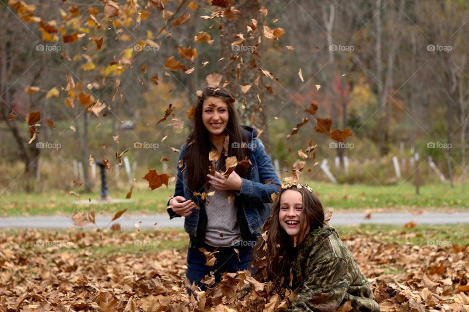Sisters in the Leaf Pile. I had a lot of fun with my sisters this weekend out in the mountains enjoying the fall weather.