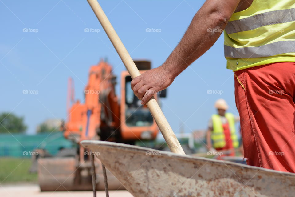 Construction worker on excavator