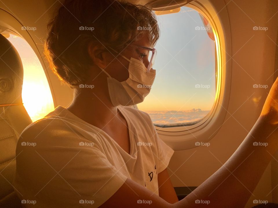 Girl inside the plane at sunset