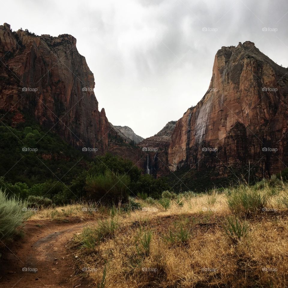The Sentinel and Abraham after an evening rainstorm in Zion National Park. If you look closely you can see two waterfalls between the two mountains. 
