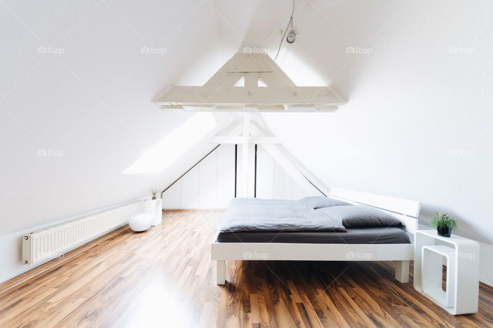 Interior view of bright loft sleeping room