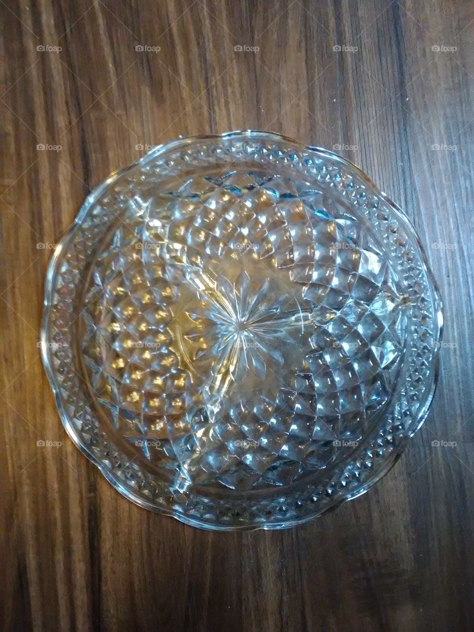 the bottom of a 1972 finish vintage glass dish see through