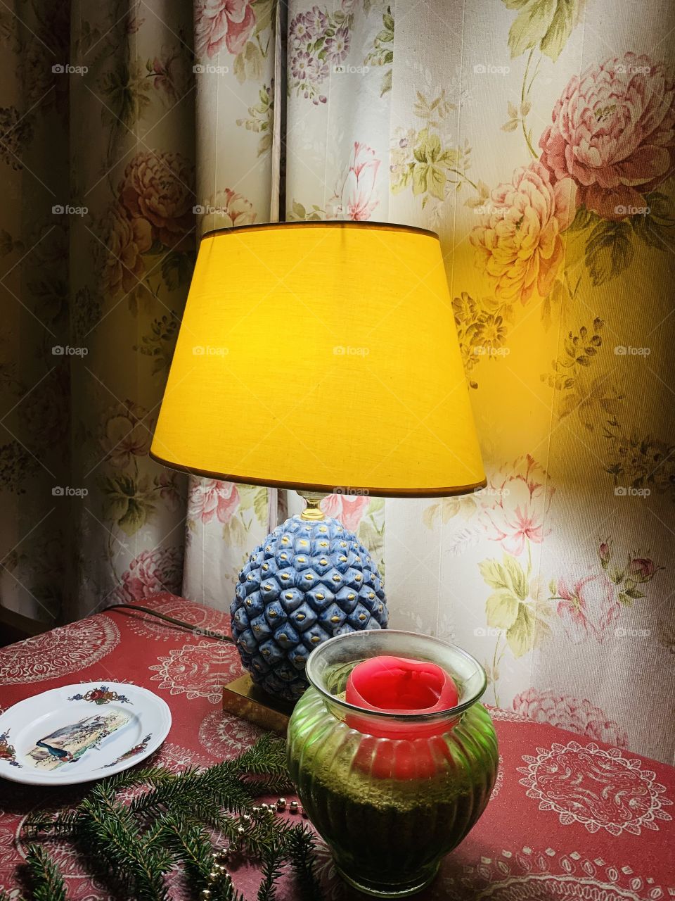 Old lamp with yellow lampshade. At home. 