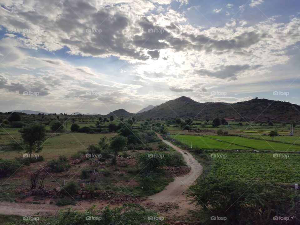 Love of Cloudy blue sky and bright green Earth
