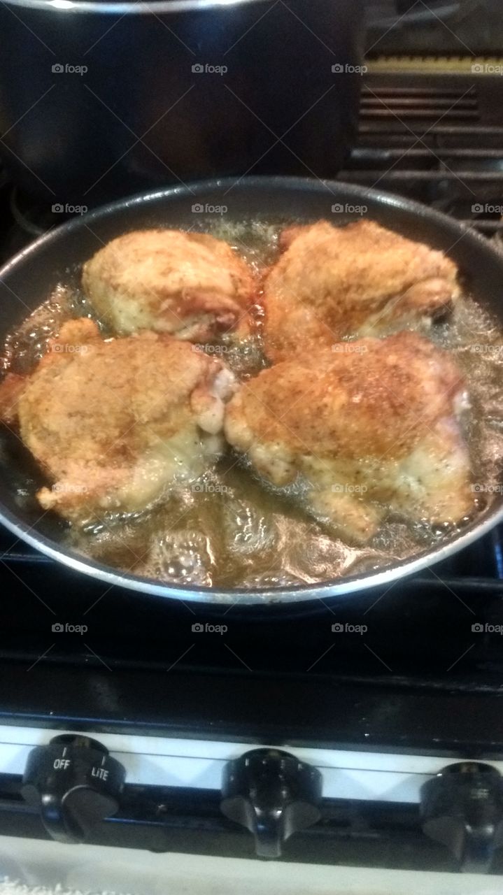 Frying chicken thighs