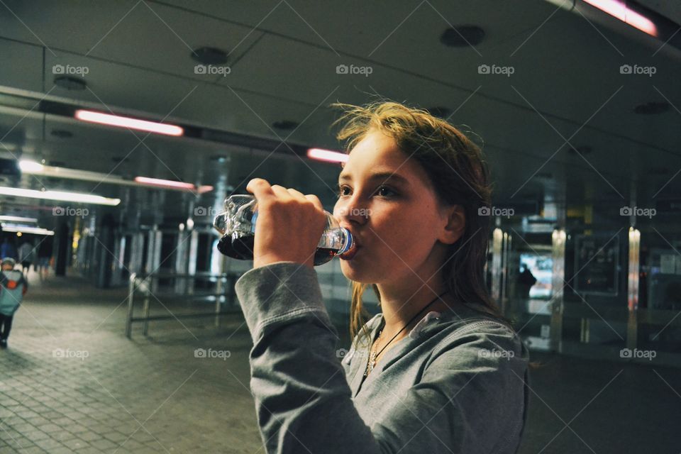 Girl drinking pepsi