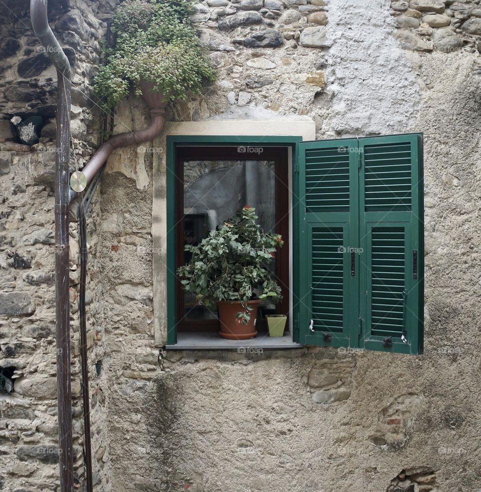 A picturesque window in the medieval town of Dolceacqua, Italy.