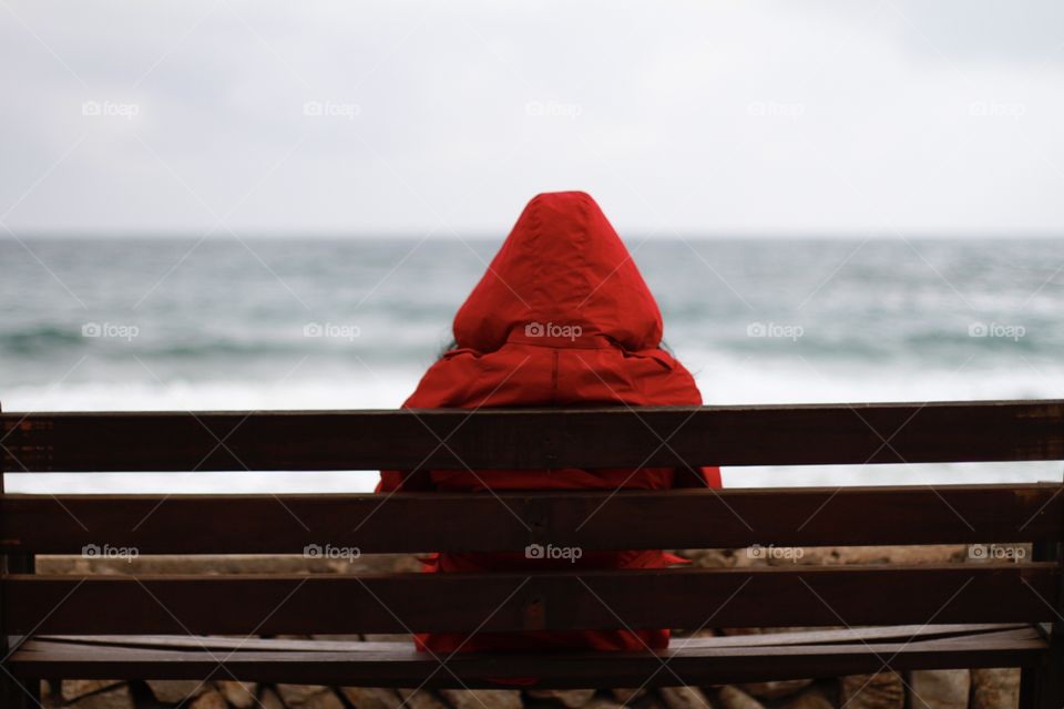 a lonely person watching the sea