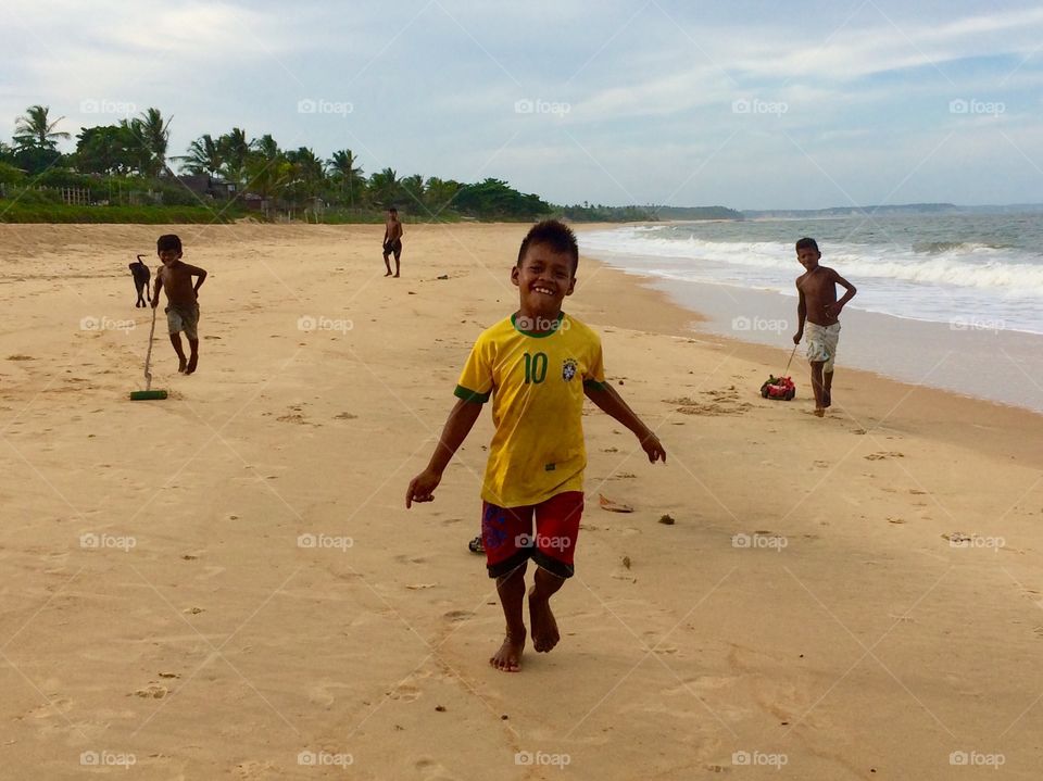 Indigenous boys playing at the beach