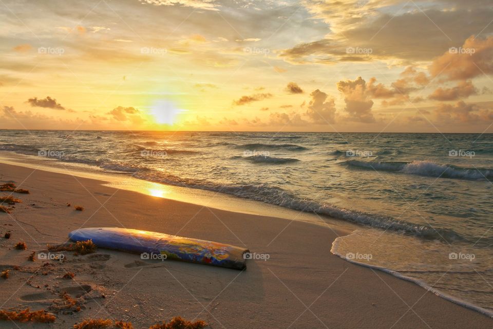 surf table on wet sand near caribbean sea