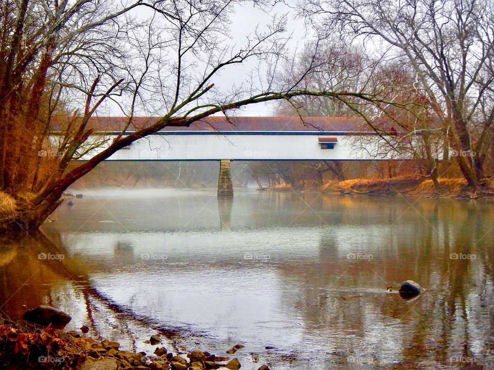 Old Potters bridge in Indiana on a foggy winter day. 