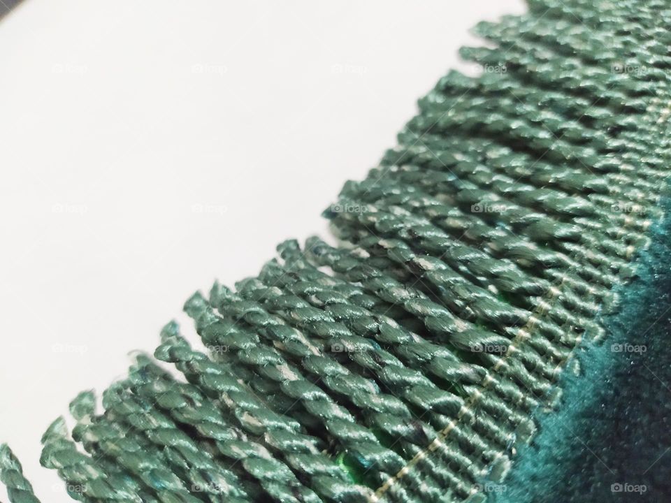 The end of the prayer mat with tassel