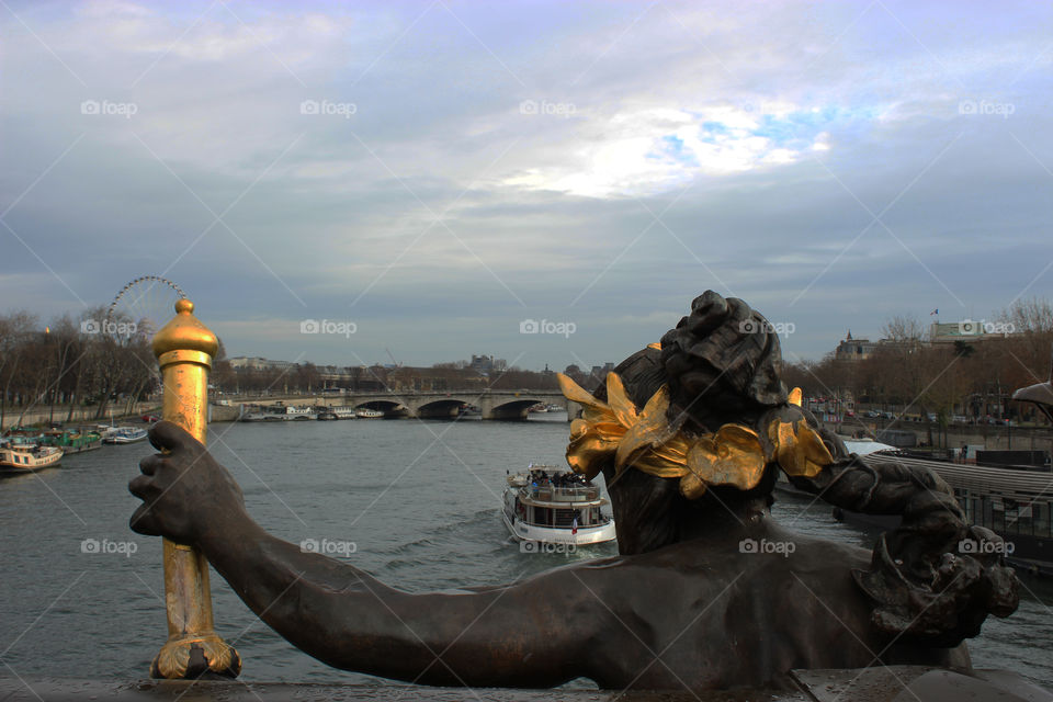 Statue looks Senna river,Paris