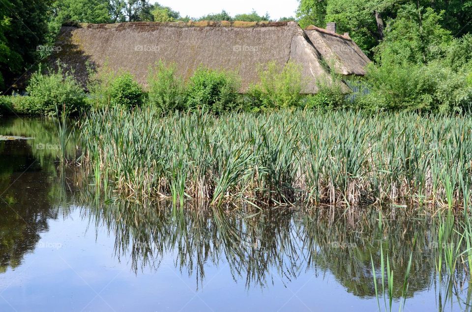 An ancient farm near pool in Belgium.